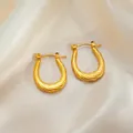Elegant gold twisted spiral U-shaped titanium steel earrings on soft beige silk - Twisted Rope Hoop Earrings 0174