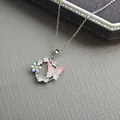Silver flower necklace featuring pink butterfly pendant and blue petals with crystals - Hollow Flower Butterfly Necklace 0373