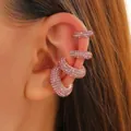 Close-up of sparkling pink rhinestone ear cuffs set on model ear without piercings - Four-Piece Set / Pink