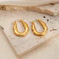 U-shaped gold twisted texture earrings on silk background for women high fashion - Lava Textured Earrings 0242