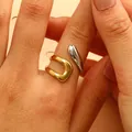 Close-up of dual-tone gold and silver irregular open ring on female finger - Two-Tone Patchwork Style (5488)