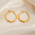 Golden bamboo texture hoop earrings in stainless steel with a stylish clasp closure - Round Bamboo Earrings 0253