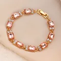Elegantes goldfarbenes Armband mit rechteckigen rosa Kristallen und funkelnden Akzenten - Champagner Pfirsichrosa Edelsteinarmband (G-314)