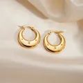 Golden titanium steel hoop earrings with engraved star patterns on satin background - Star Pattern Round Earrings 0259