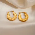 Golden titanium steel hoop earrings featuring vintage hammered texture on cream satin - Crumpled Round Earrings 0260