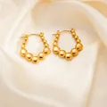 Gold titanium steel U-shaped earrings with gradient beads on champagne silk background - Beaded Cluster Earrings 0278