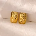 Macro shot of gold camellia earrings with spiral relief texture on a stone prop - Rectangular Scroll Swirl Style (G8145099) / Gold