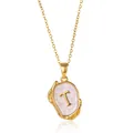 Detail of 18K gold-plated letter T pendant with mother of pearl and lava texture - Gold T