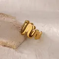 Detail of minimalist 18K gold plated wavy ring on stone, modern geometric design - Matte Wavy Undulating Style (G8316973) / Gold