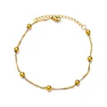 Detail of twisted gold chain anklet with polished beads and lobster clasp adjustment - Gold Twisted Metal Bead Style (G609375)
