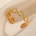 Detail of gold-plated stainless steel anchor link ring on beige silk background - Anchor Chain Style (G3294859) / Gold