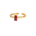 Close-up of golden adjustable ring with rectangle red zircon in four-prong setting - Adjustable Open / July