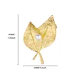 Detail shot of golden leaf brooch with hammered texture and pearl, 47mm x 33mm size view - Leaf Shape (G524295-t)