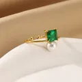 Elegant gold open ring featuring a square emerald gemstone and a round white pearl - Adjustable Open / Square Emerald Pearl Style (G6247824G-2)