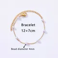 Λεπτομέρεια από επιχρυσωμένο βραχιόλι Figaro 18K με πέρλες 4mm και κούμπωμα καβουράκι - Βραχιόλι με Τεχνητά Μαργαριτάρια / 12+7cm (4mm Διάμετρος Χάντρας) / Χρυσό