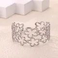 Detail of silver-colored hollow floral open bangle with delicate textured finish - Double Layer Flower Style (P10302177) / Silver