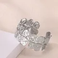 Close-up of floral cuff bracelet featuring textured petals and a silver metallic finish - Four-petal Flower Style (P10302176) / Silver