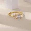 Detailed close-up of a gold-plated copper ring with three square-cut zircon stones - Square Zirconia Three-Stone Style (G1228567)