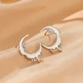 Star and moon stud earrings in bright silver finish with artistic lava drop texture - White KA Silver Fluid Crescent Stud Earrings (A-785)