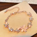 Rose gold floral bracelet featuring pink cat eye stones and sparkling crystals - Pink Cat Eye Flower (WG-1335) / Rose Gold