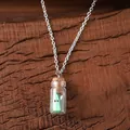 Luminous green ghost in a glass bottle pendant necklace with silver chain on wood - Green Necklace (Small)