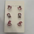 Three pairs of sweet acrylic gnome earrings with football themes on a display card - Rugby Gnome Combo (X116)