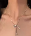 Elegant silver bow pendant necklace on thin snake chain for a minimalist look - Asymmetric Bow Silver Thin Snake Chain (K-199) / Silver