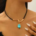 Baroque style necklace featuring a black cord and a bright sky blue irregular pendant - Turquoise Style (1075)