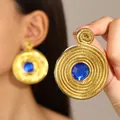 Vintage oversized round earrings with gold braided texture and deep blue crystal center - Vintage Woven Blue Rhinestone Style (G-557) / Gold