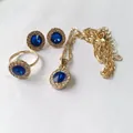 Luxury 4-piece jewelry set with blue round crystals and gold necklace in blue finish - Round Blue Halo Gemstone Set (01 KC Gold Blue A-768)