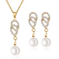Elegante set di gioielli dorati con perle bianche e cristalli scintillanti - Set Perla Curve Intrecciate (3026)