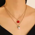 Festive gold layered necklace featuring a red bell and a white reindeer enamel pendant - Reindeer Style (N-1118) / KC Gold