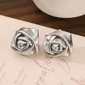 Vintage 3D silver rose flower stud earrings with metallic leather texture on pink card - Textured Rose Stud Earrings (02 Silver 3746) / Silver