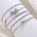 5-teiliges silbernes Armband-Set mit Schmetterling, Knoten-Detail und funkelnden Strasssteinen - Schmetterling Strass 5-teiliges Set (7174)