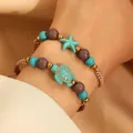 Detail of bohemian woven bracelets featuring turquoise turtle and starfish charms - Turtle Starfish Combination (39 Turtle Starfish 1084)