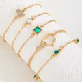 5-piece gold bracelet set with emerald green gems, butterfly and heart charms - Gold (6402)