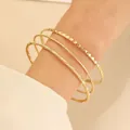 Three-piece gold-tone alloy bangle set with hammered, twisted, and frosted textures - Gold (0117)