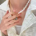 Asymmetric pearl and gold multi-chain necklace with sparkling butterfly pendant - Gold Spliced Artificial Pearl Style (1152)