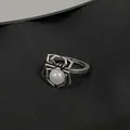 Gothic silver spider ring featuring a white faux pearl center on a textured surface - Spider Artificial Pearl Ring (M-691) / Antique Silver