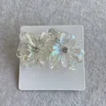 Chic Y2K iridescent floral stud earrings with acrylic petals and center crystal accents - Clear