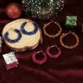 Three pairs of glitter-wrapped Christmas C-hoop earrings in blue, orange, and rose pink - 3 Pairs/Set Ribbon Wrapped C-shape Hoop Decor
