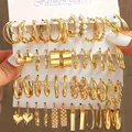 Detail of 24-piece vintage gold earring set with pearls on a white display card - Gold (24-Pair Set)