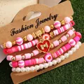 Set di 5 bracciali a strati con perline di argilla rosa e ciondolo a cuore rosso - Stile Cuore Fiocco Rosa Bianco (HS1586-6)