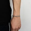 Detailed view of silver stainless steel rope chain bracelet on wrist with high metallic luster - Width 5mm-Length 22.86cm / Steel