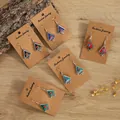 Five pairs of Bohemian alloy triangle dangle earrings with multi-color stone inlays on cards - Red Triangle Pattern