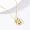 Sparkling 18K gold clover necklace with heart-shaped pendants and diamond inlay on white base - Gold