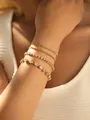 Set of four gold-finish tennis bracelets with sparkling zircons on model wrist - Gradient Sizes Tennis Bracelet Combination (0561) / Gold
