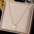 Elegant heart pendant necklace in gold finish with white inlay on a luxury jewelry box - Heart Inlaid with Artificial Pearl
