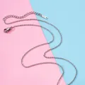 Close-up of a slim stainless steel chain with a lobster clasp and S.Steel tag detail - O-Chain (Adjustable) / Steel
