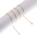 Close-up of a slim golden snake chain necklace with lobster clasp on a white stand - Thin Snake Chain / Gold
